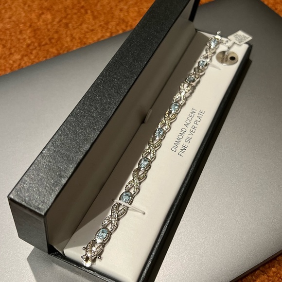 Silver Blue Topaz Infinity Bracelet - Picture 2 of 6